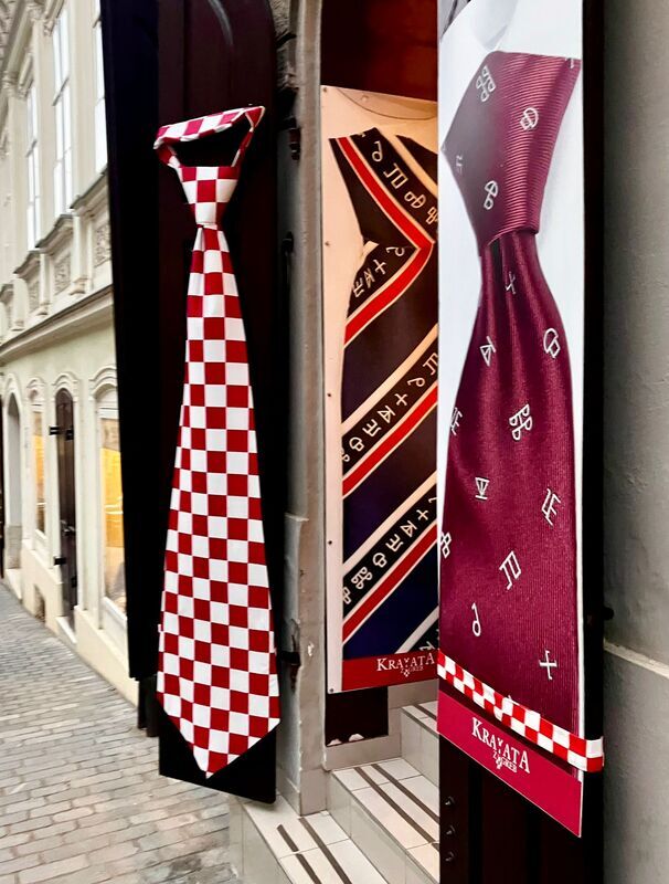 1000014695.jpg Advertisements for a tie shop.