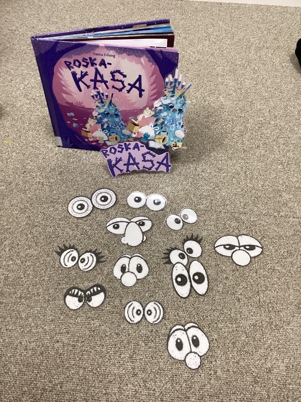 Kasa kirja ja silmien kuvia