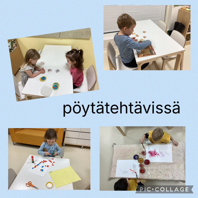Lapsia pöytäpuuhissa mm. rakentamassa palapeliä,maalaamassa,leikkaamassa saksilla