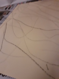 Hämähäkin seitti paperille viivoin. Näin tuli opeteltua suoran viivan piirtämistäkin.
