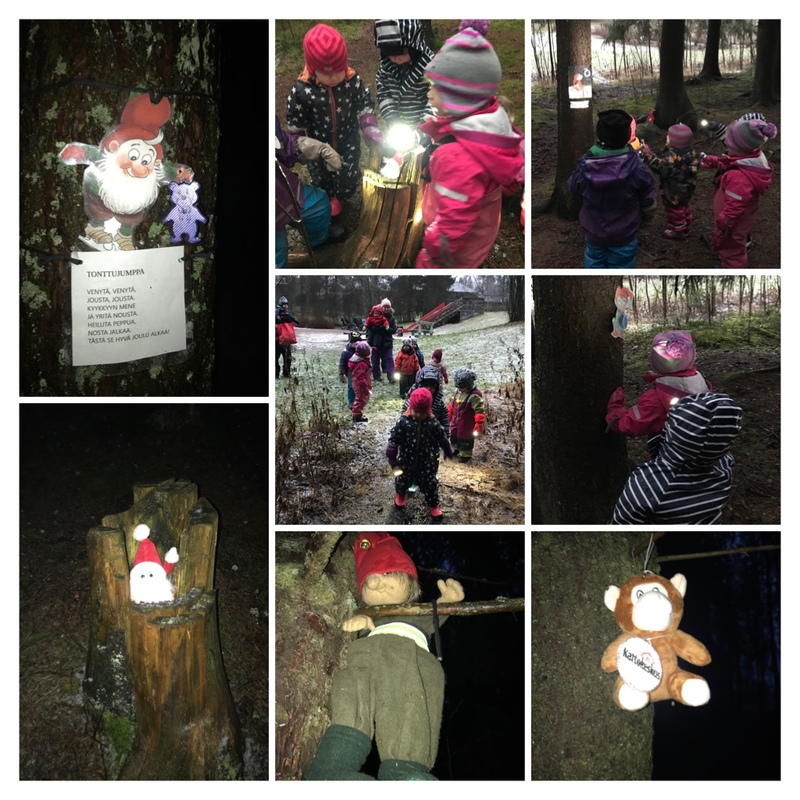 Lapset etsimässä tonttuja metsästä taskulamppujen avulla.