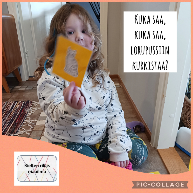 Lapsi lorukortti kädessä