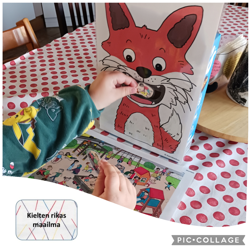 Lapsi pelaa Roihuset-peliä