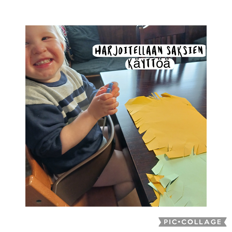 Lapsi leikkaa paperia