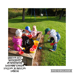 Lapset leikkivät hiekkalaatikolla