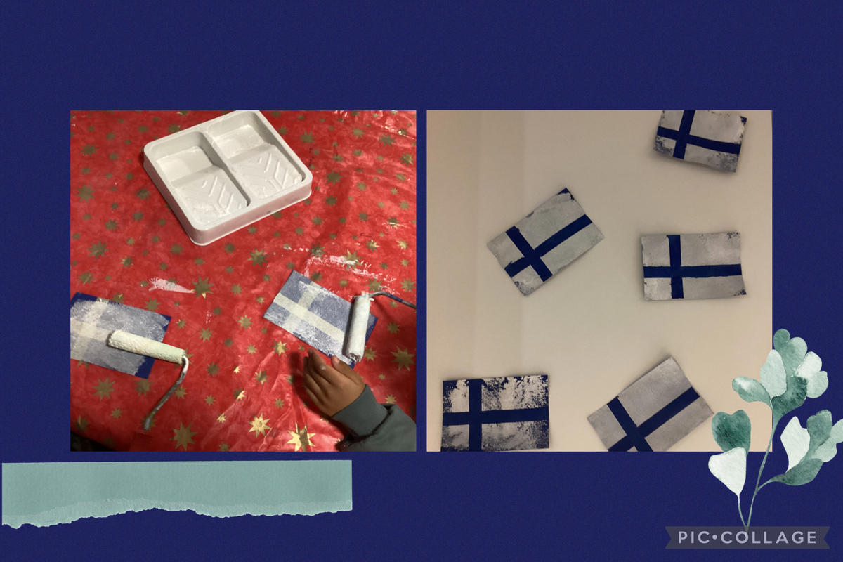 Suomen lippuja Suomen lippuja askartelemassa ja valmiit askarrellut suomen liput.