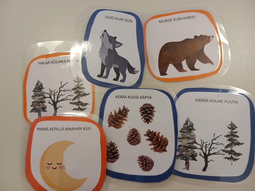 Marraskuun metsäretkellä harjoittelimme taikametsän menninkäisten metsätaitotemppuja