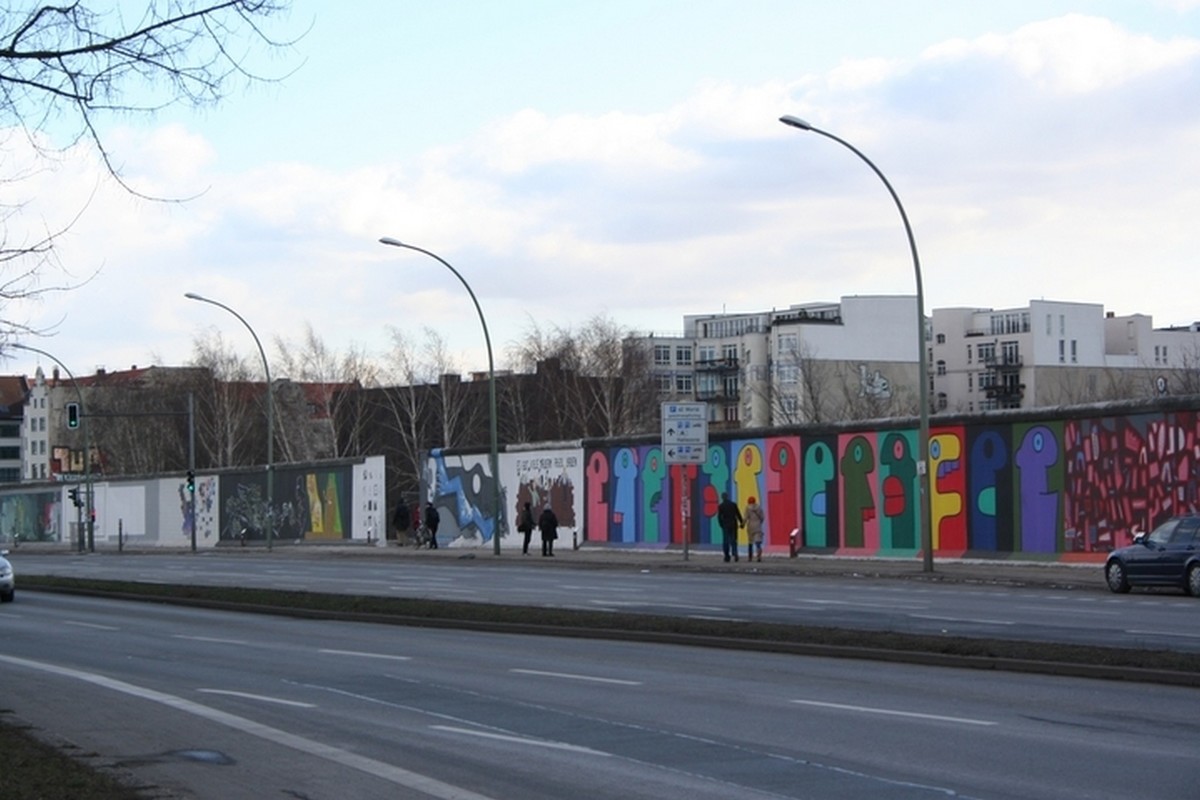 The Berlin wall was built in the middle of the 20th century, when the nation and its capital city were divided into two nations. The nations of East and West Germany were united in the year 1989.